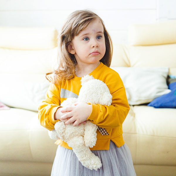 sad-little-girl-with-teddy-bear-in-her-hands-stand-2022-11-16-22-02-56-utc